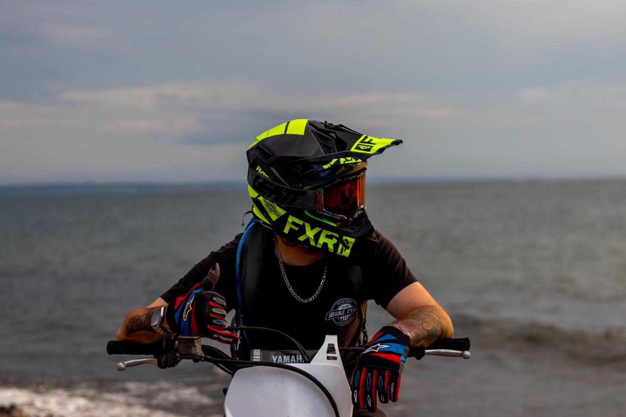 dirt bike rider with ocean in background