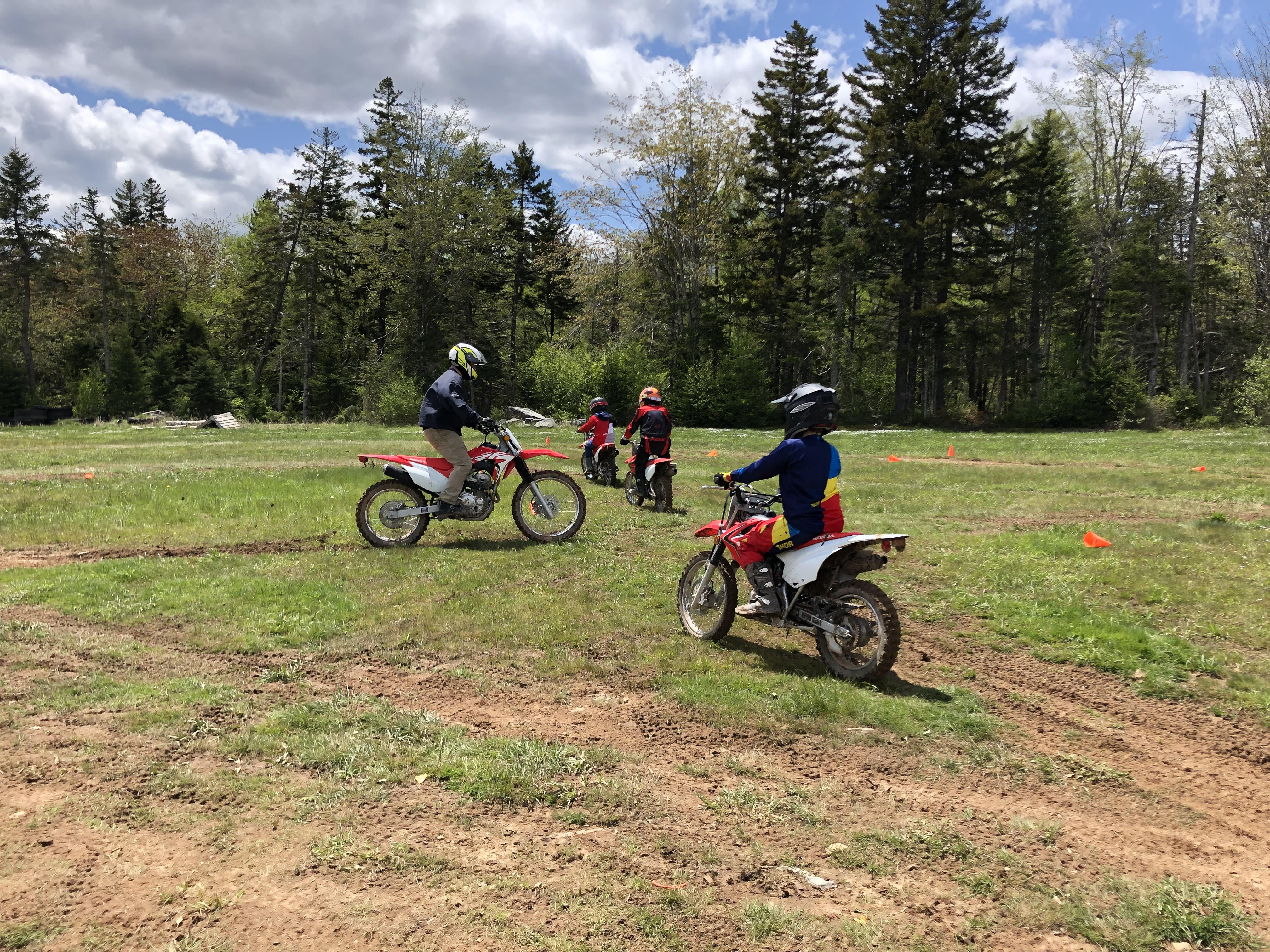riders on their bikes doing a figure 8