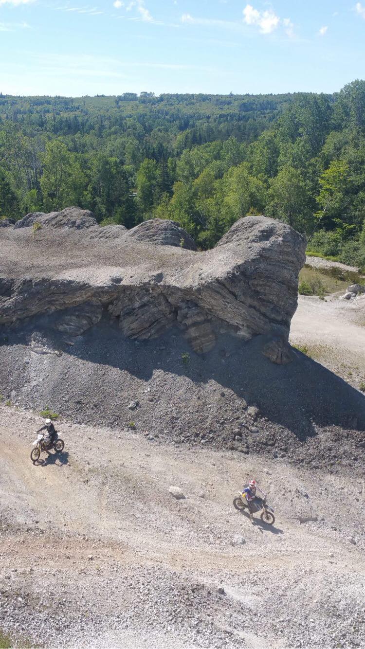 land feature and dirt bike riders