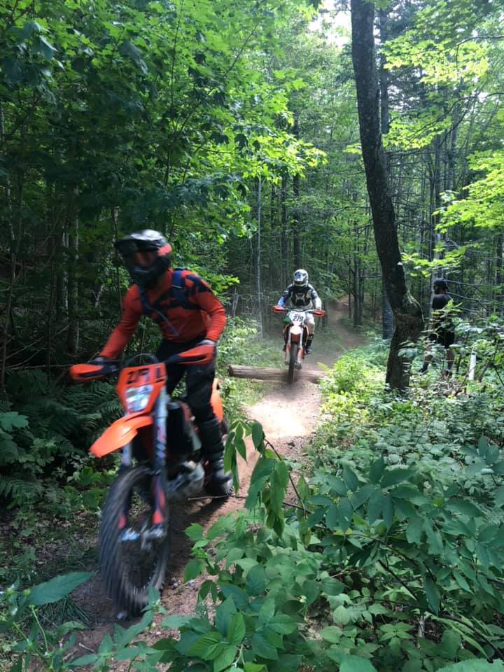 Dirt bike riders in woods