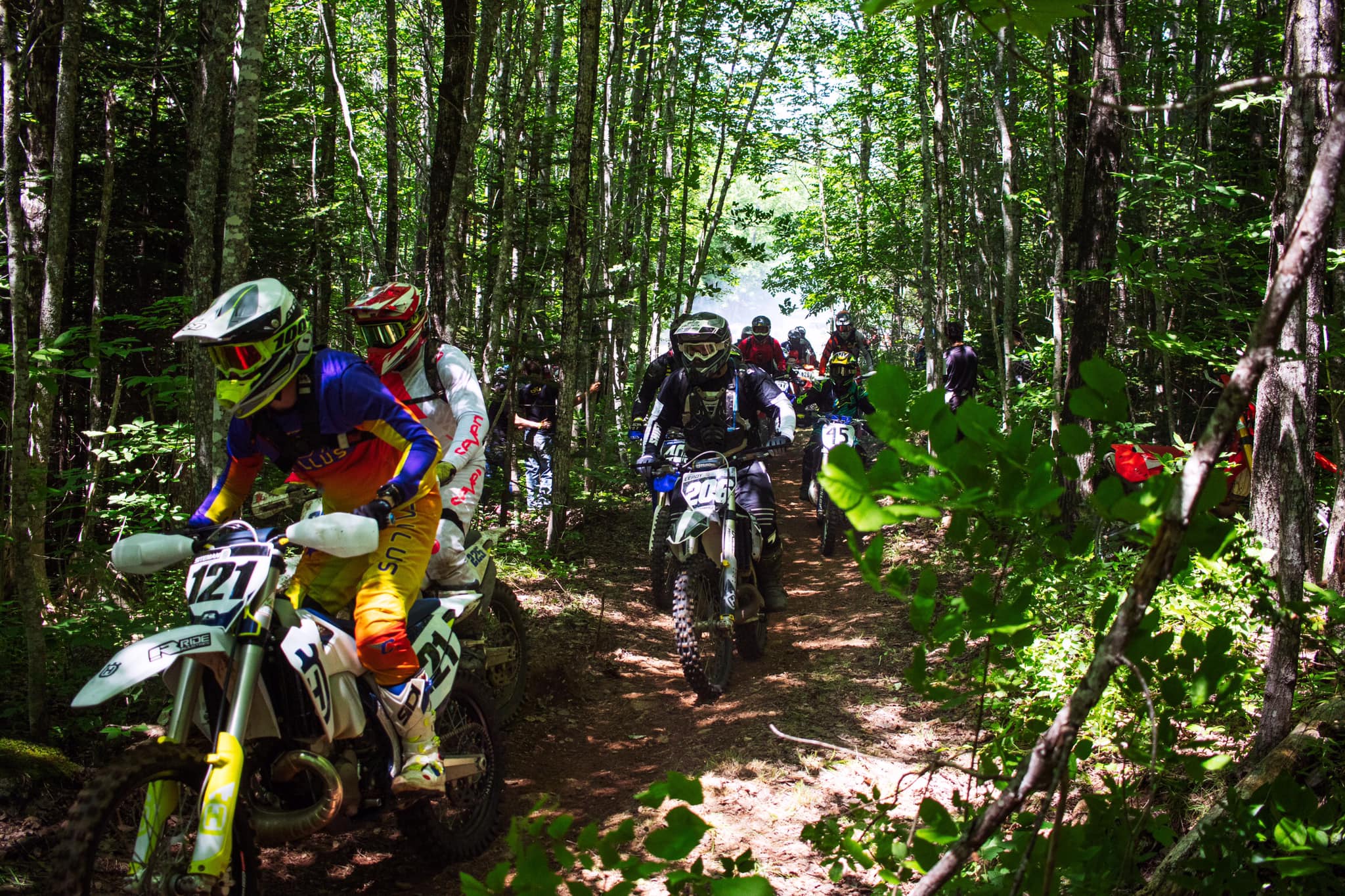 Riders racing through the woods at South Alton