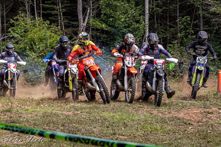 Dirt bike racers take off at the start