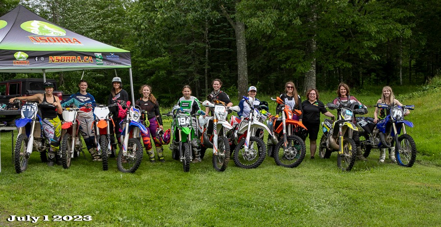 lineup of women riders and their bikes