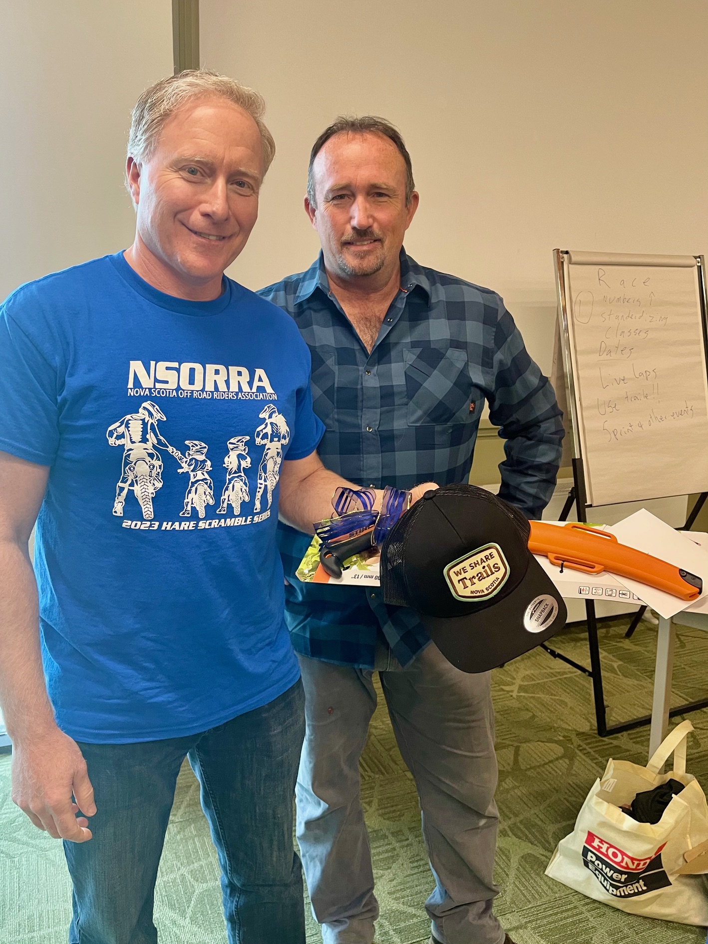 Neil receiving a gift from NSORRA President Josh Kelly
