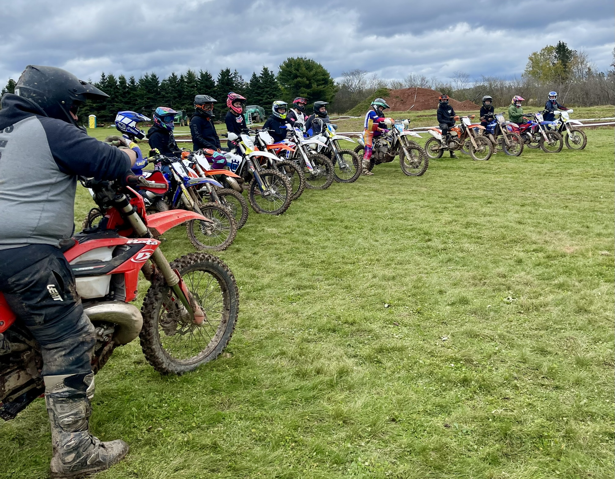 line of women dirt bikers in full gear