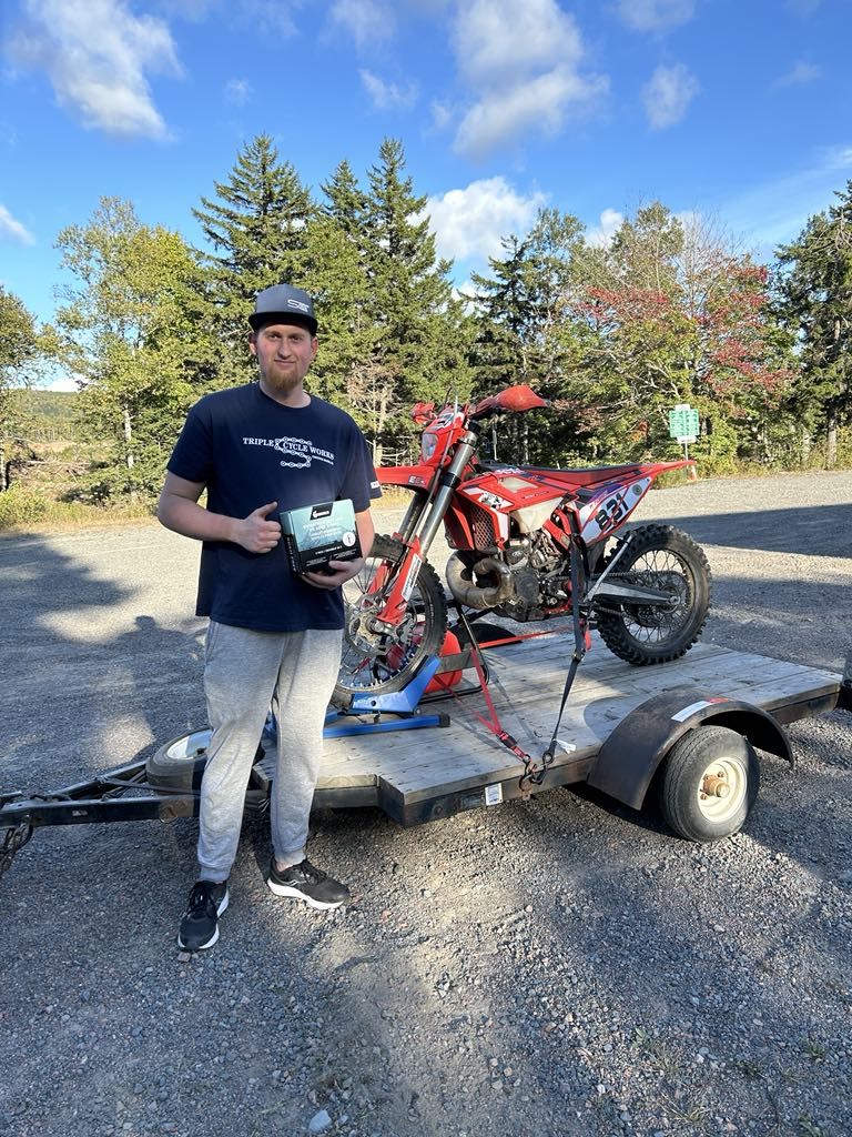 Matthew with his bike and staps