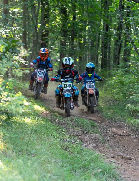 Three youth hare scramblers on the trail