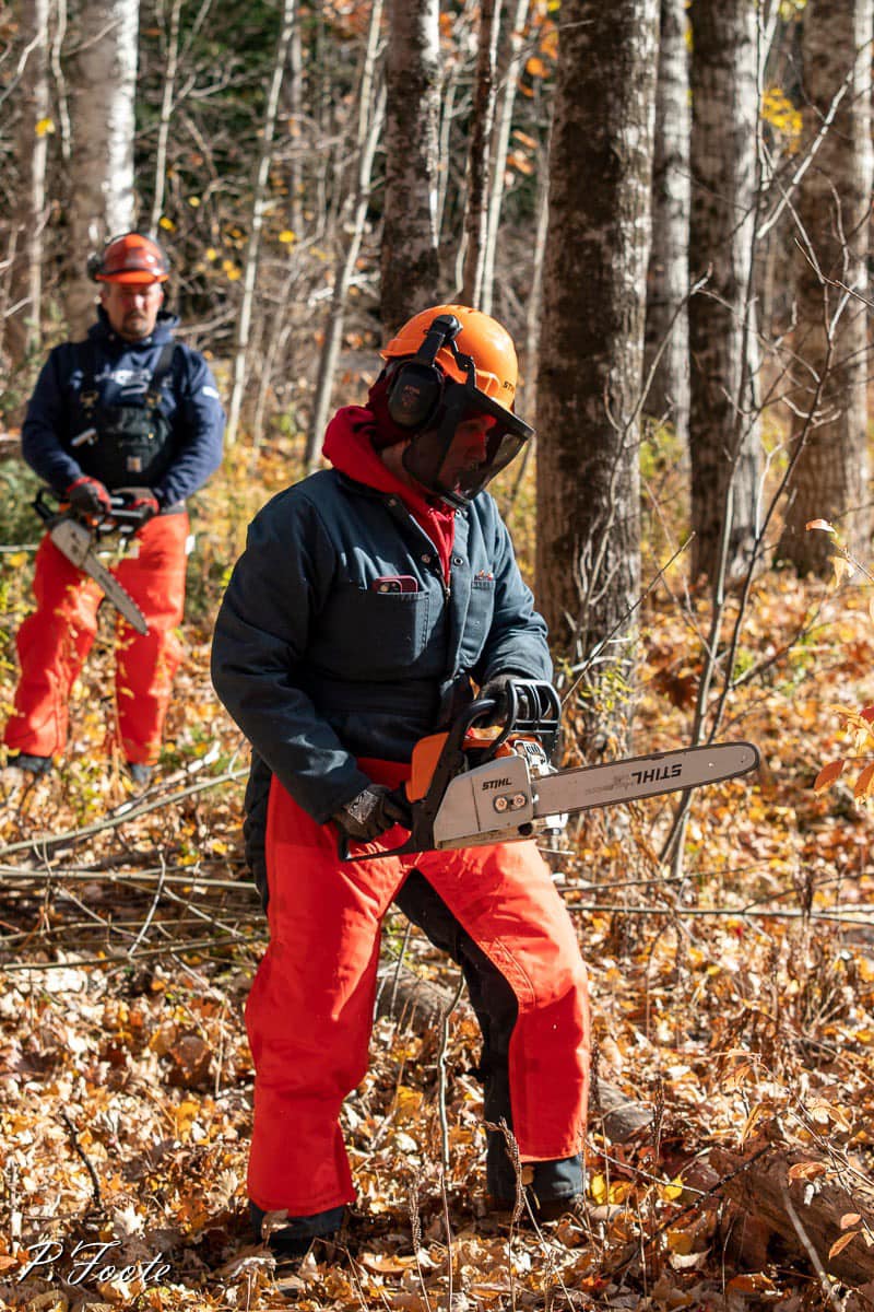 Participant using the chainsaw