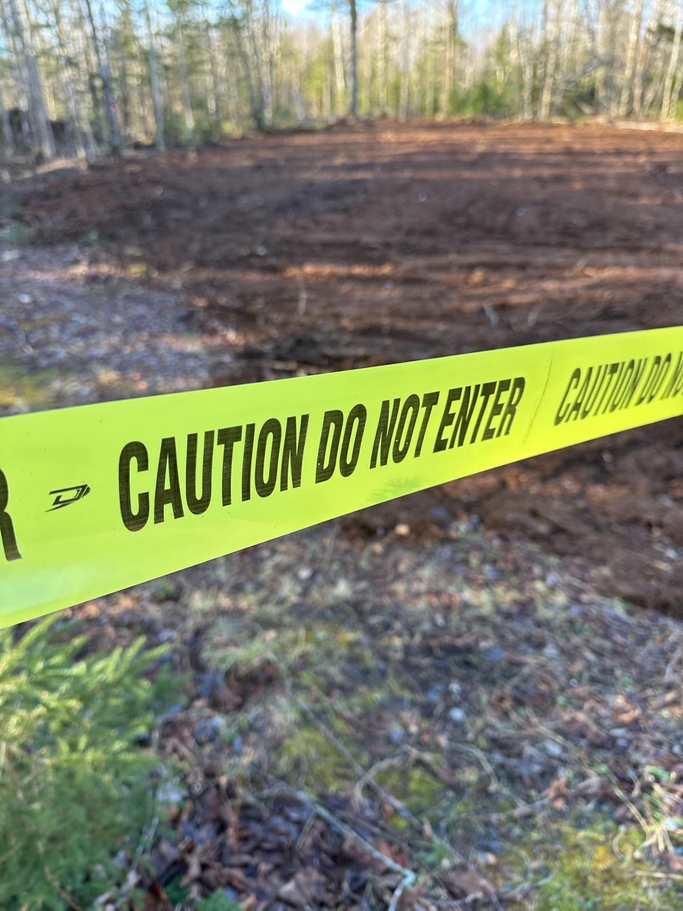 Caution tape around new parking area